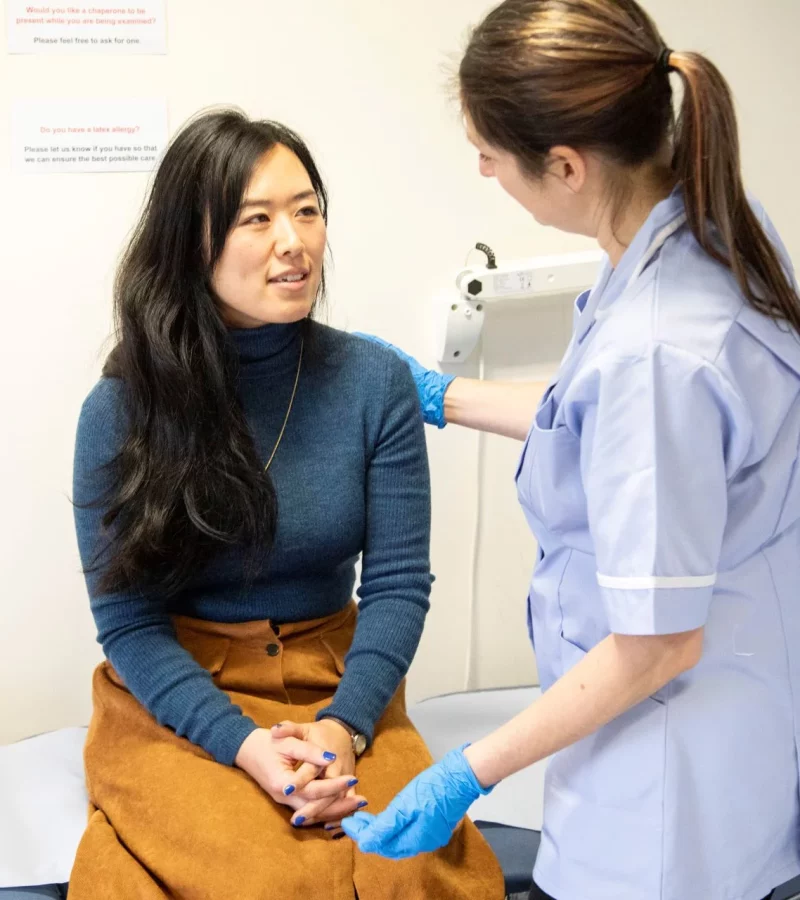 A practice nurse checking a patient’s vital signs