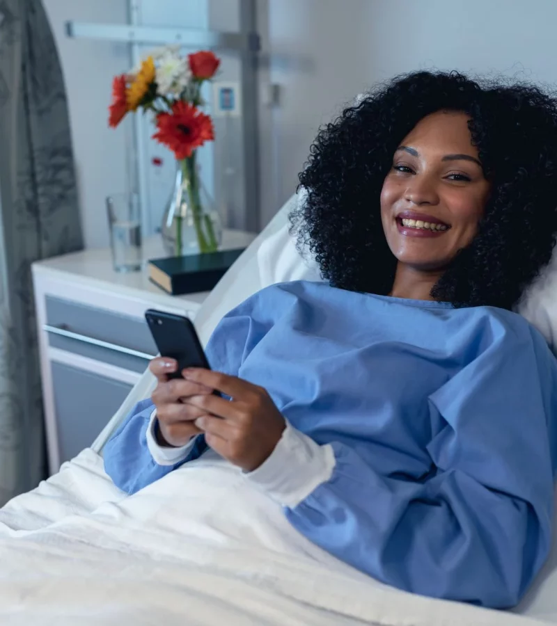 A patient smiling during a consultation