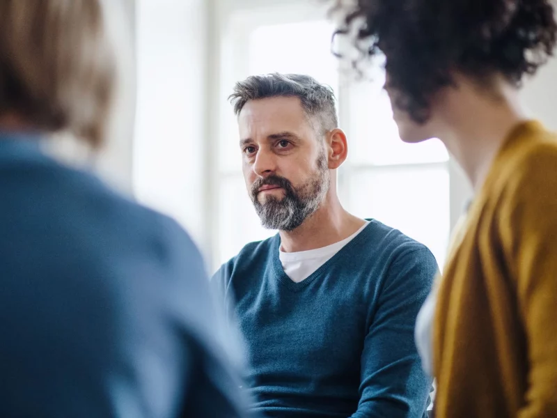 A support group seated in a circle