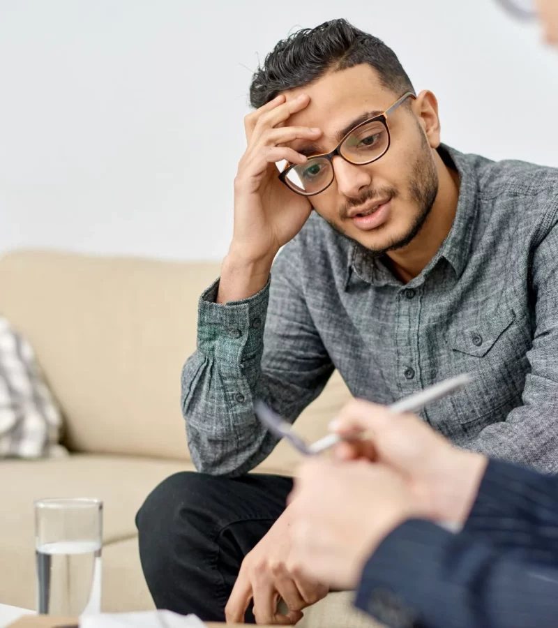 A psychologist in consultation with a patient