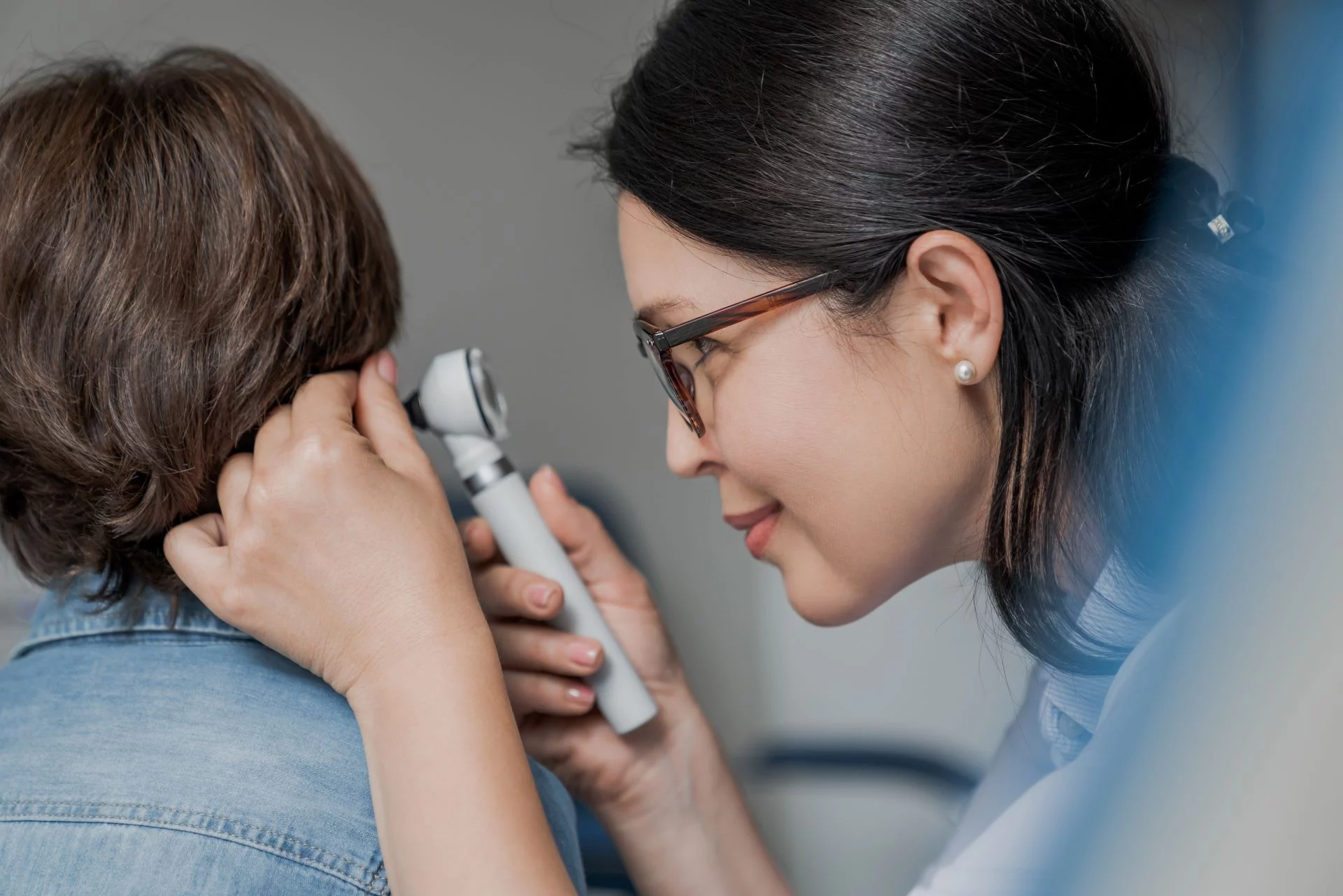 A dermatologist examining a patient's skin