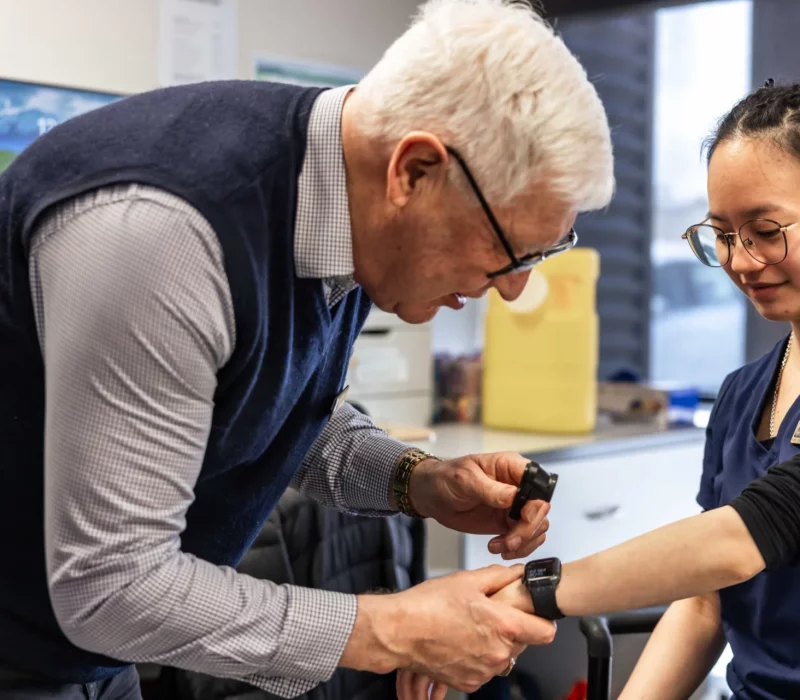 A doctor carrying out a skin check