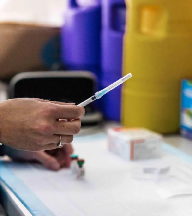 A nurse preparing a vaccination